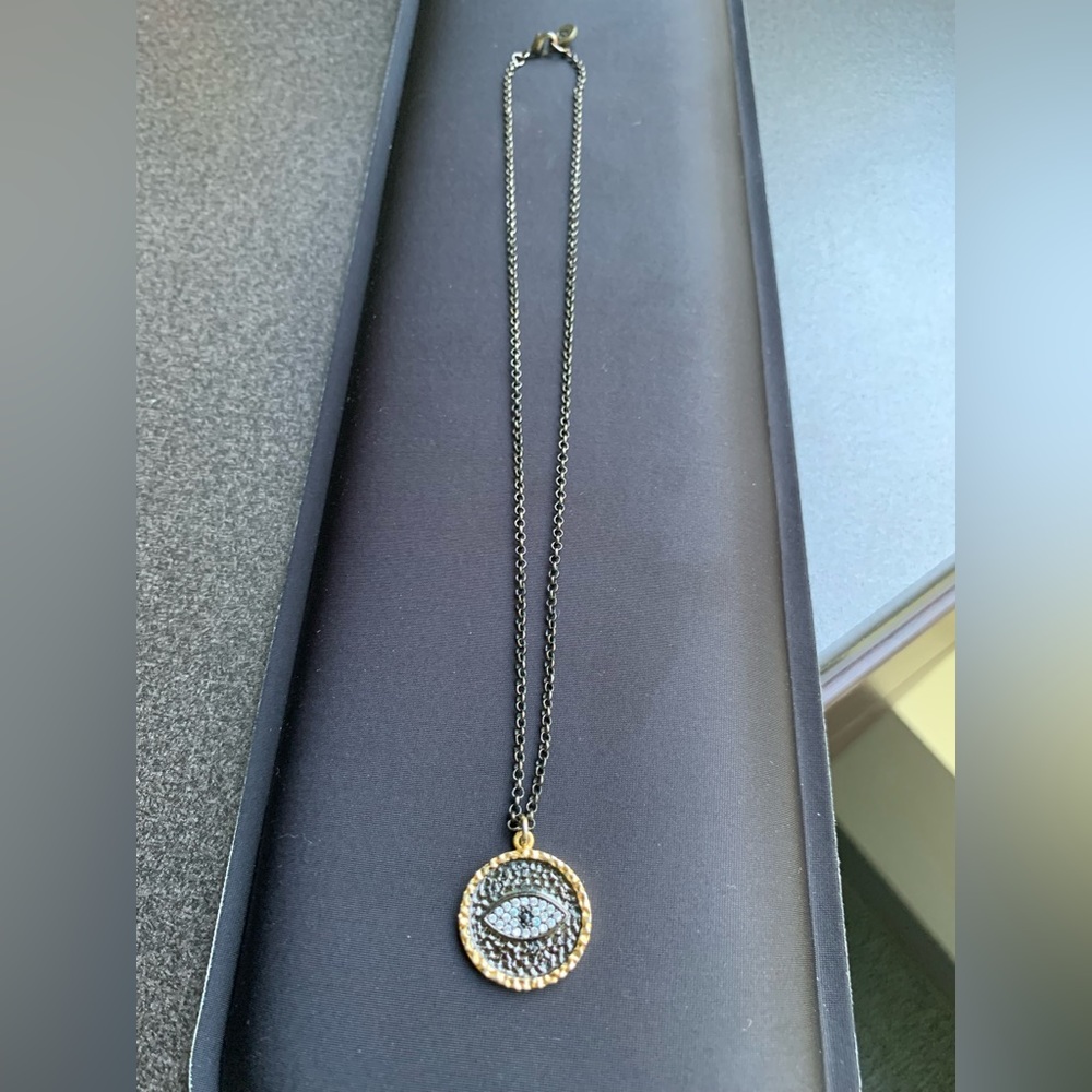 Raw & Rebellious evil eye disc necklace. Two tone